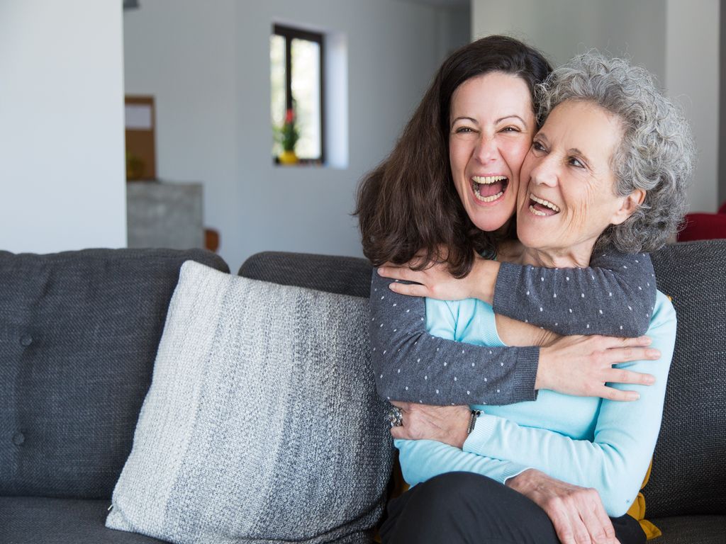 happy-woman-embracing-her-senior-mother